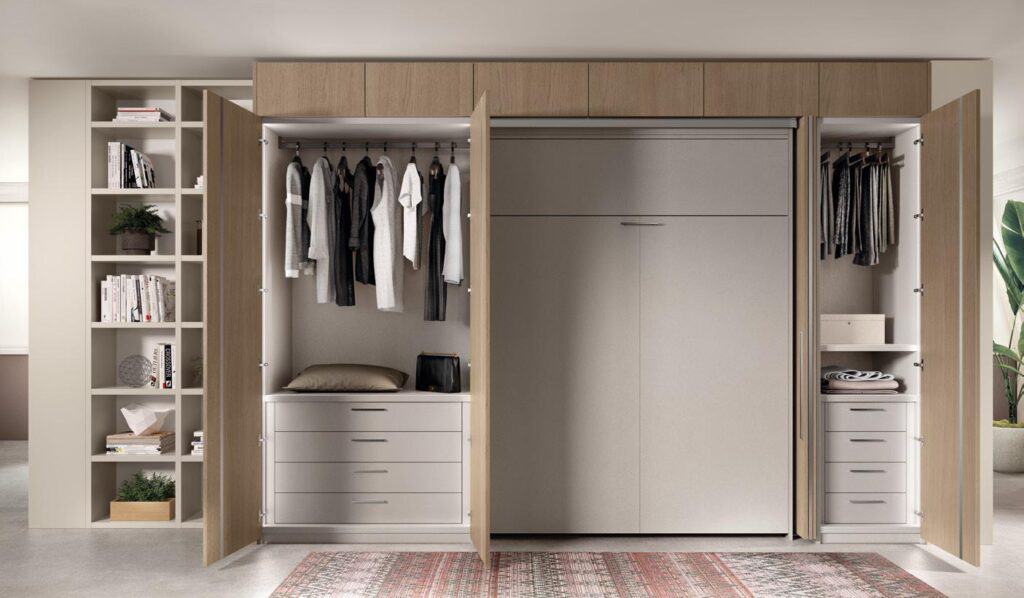 A modern wardrobe with open wooden doors, showcasing hanging clothes, shelves with books and decorations, including a plant.