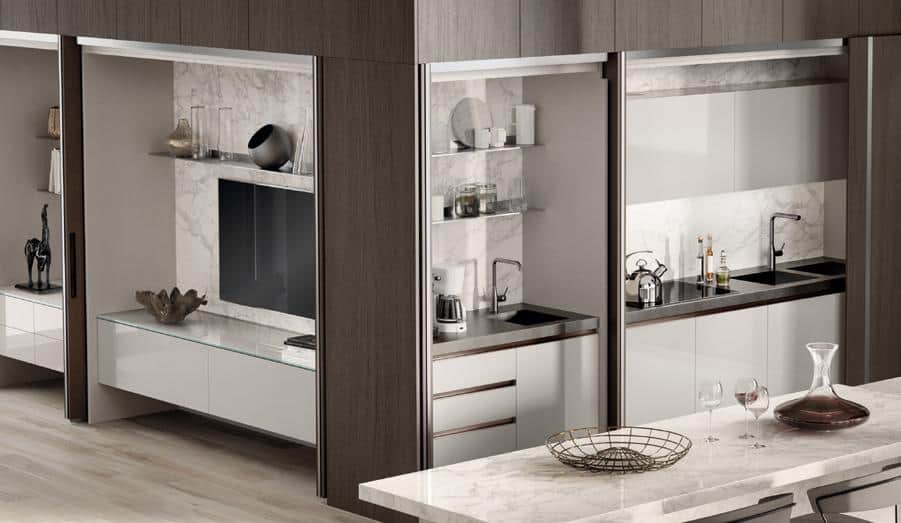 Modern kitchen with marble countertops, integrated appliances, and open shelving.