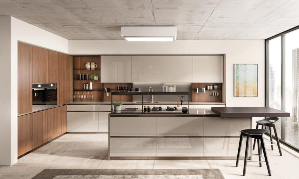 Modern kitchen interior with wood accents, beige cabinetry, a central island with a cooktop, bar stools, and floor-to-ceiling windows.