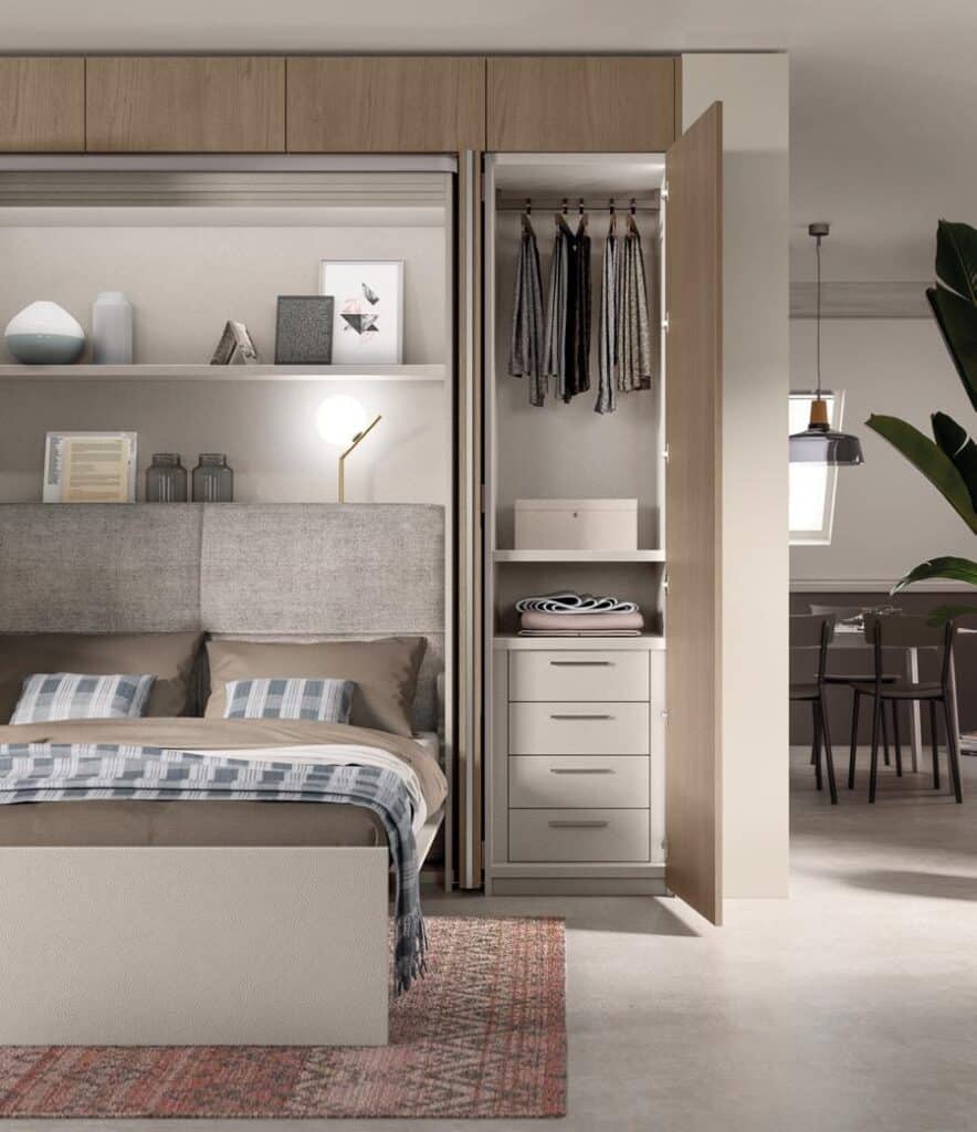Modern bedroom with built-in wooden wardrobe, shelf with decor, and neatly made bed.