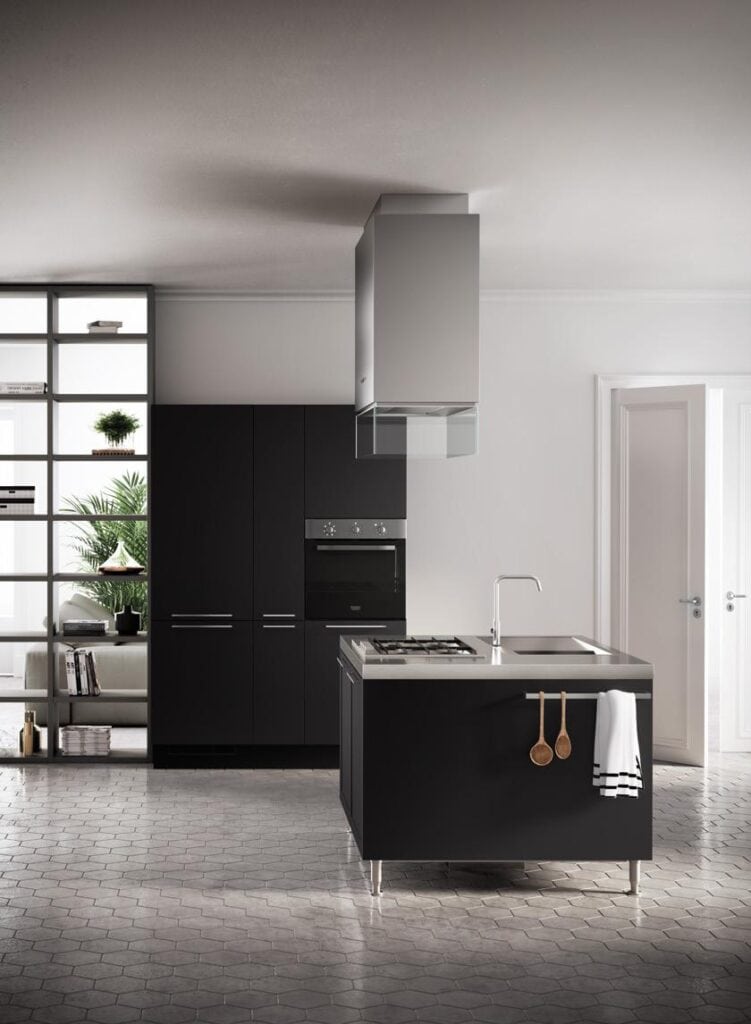 Modern kitchen with dark cabinetry, a central island with a stove and sink, and a sleek overhead hood.