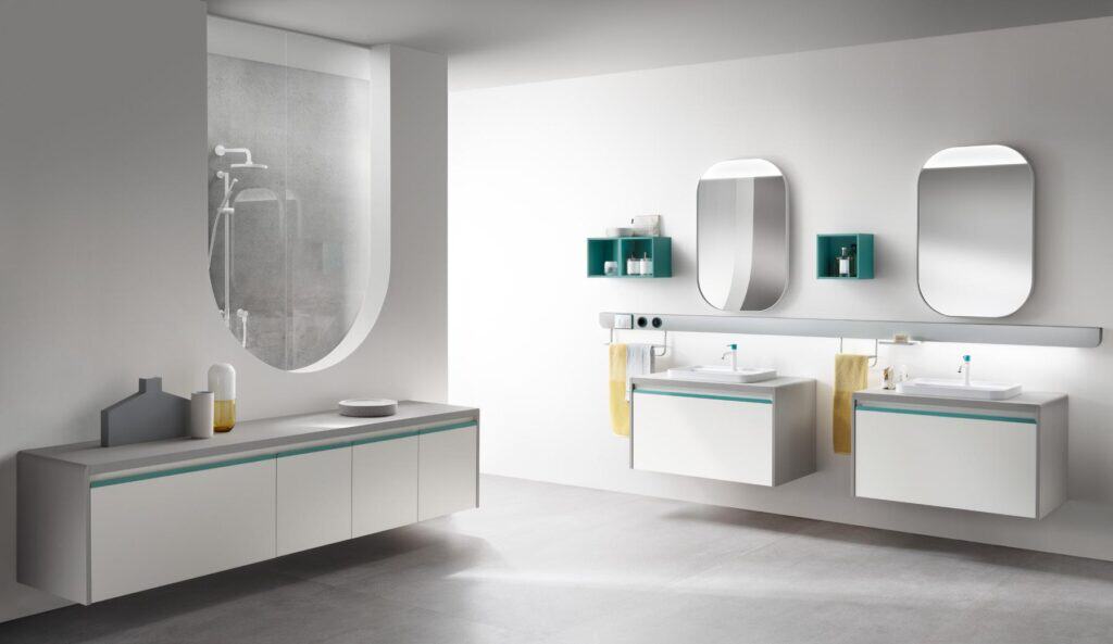 Modern bathroom with two wall-mounted sinks, large mirrors, a unique shower space with a curved glass panel, and sleek cabinetry.