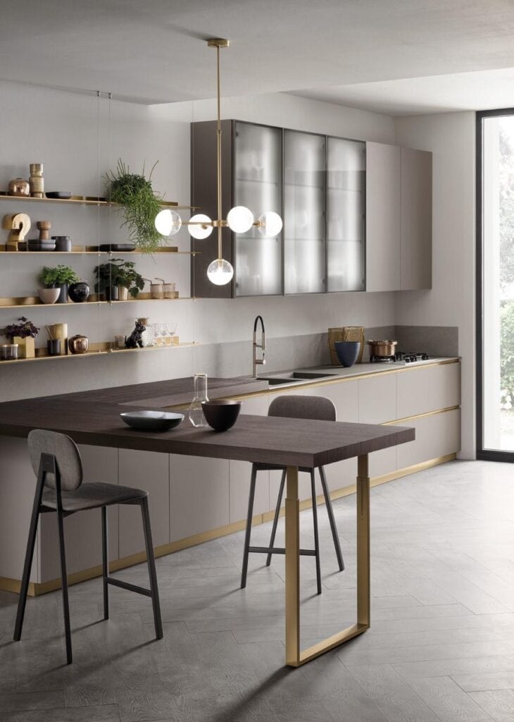 Modern kitchen with minimalist design, featuring sleek cabinetry, floating shelves, and a contemporary light fixture.