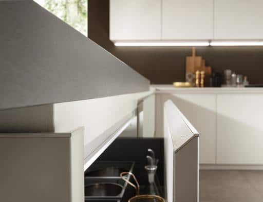 Modern kitchen with sleek cabinetry, hidden appliances, and minimalist design.