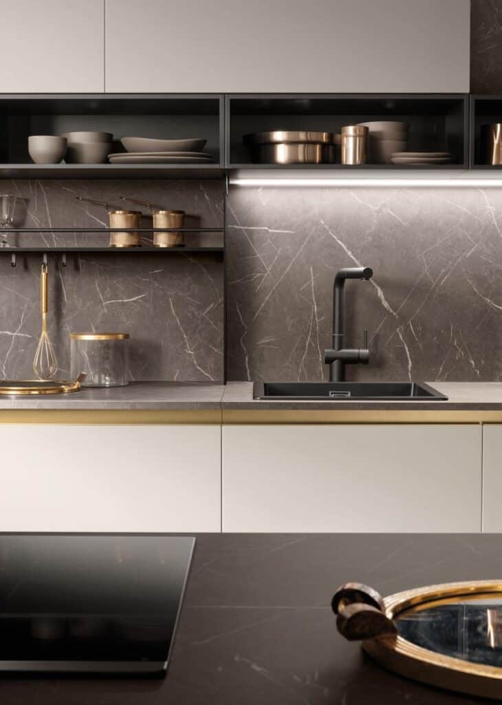 Modern kitchen with dark marble backsplash, black faucet, and open shelving displaying dishes and cookware.