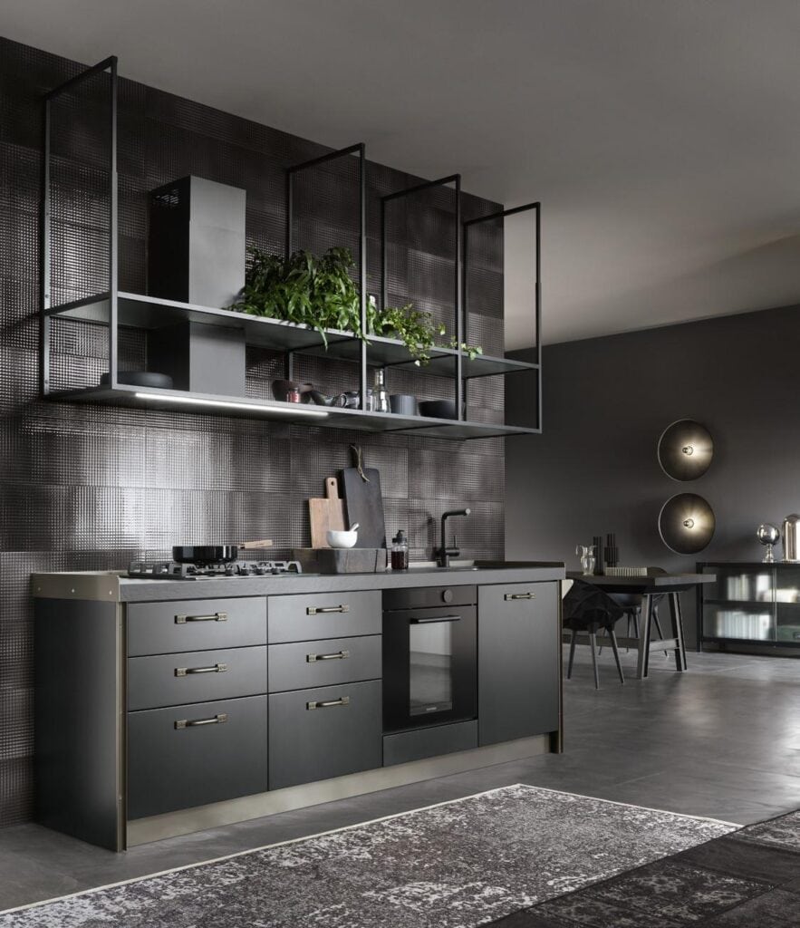 Modern kitchen with dark cabinetry, open shelving, and metallic accents.