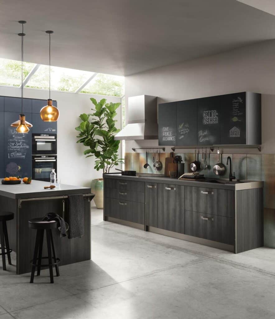 Modern kitchen with dark wood cabinets, an island with barstools, pendant lighting, and a large plant.