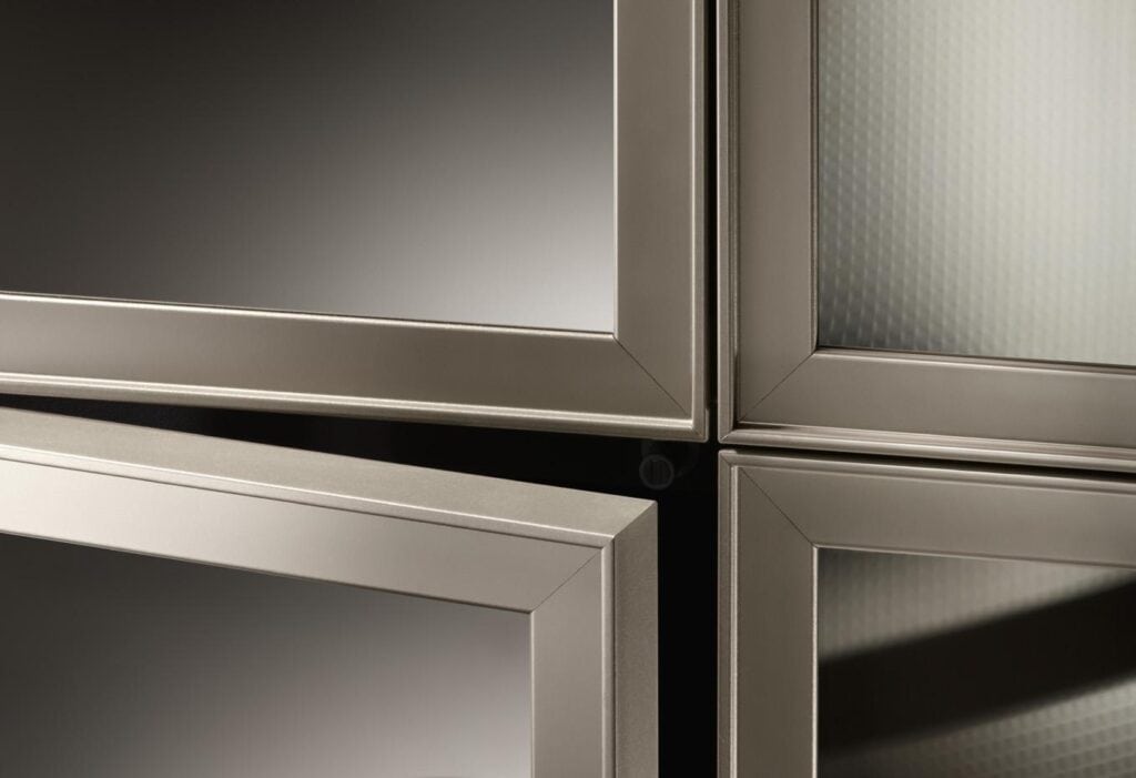Close-up of metallic framed glass panels in a minimalist design.