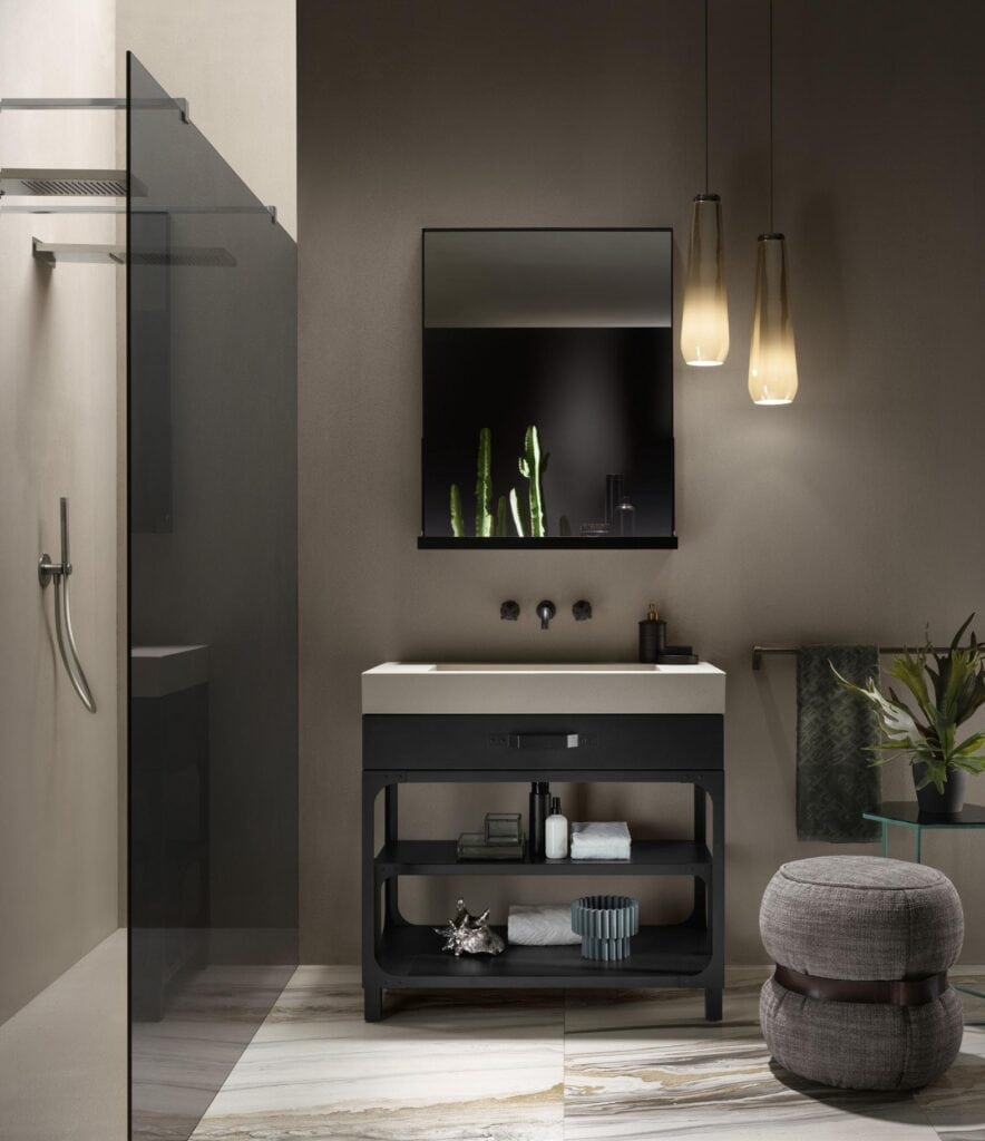 Modern bathroom with a black vanity, large mirror, pendant lights, and a glass shower enclosure.