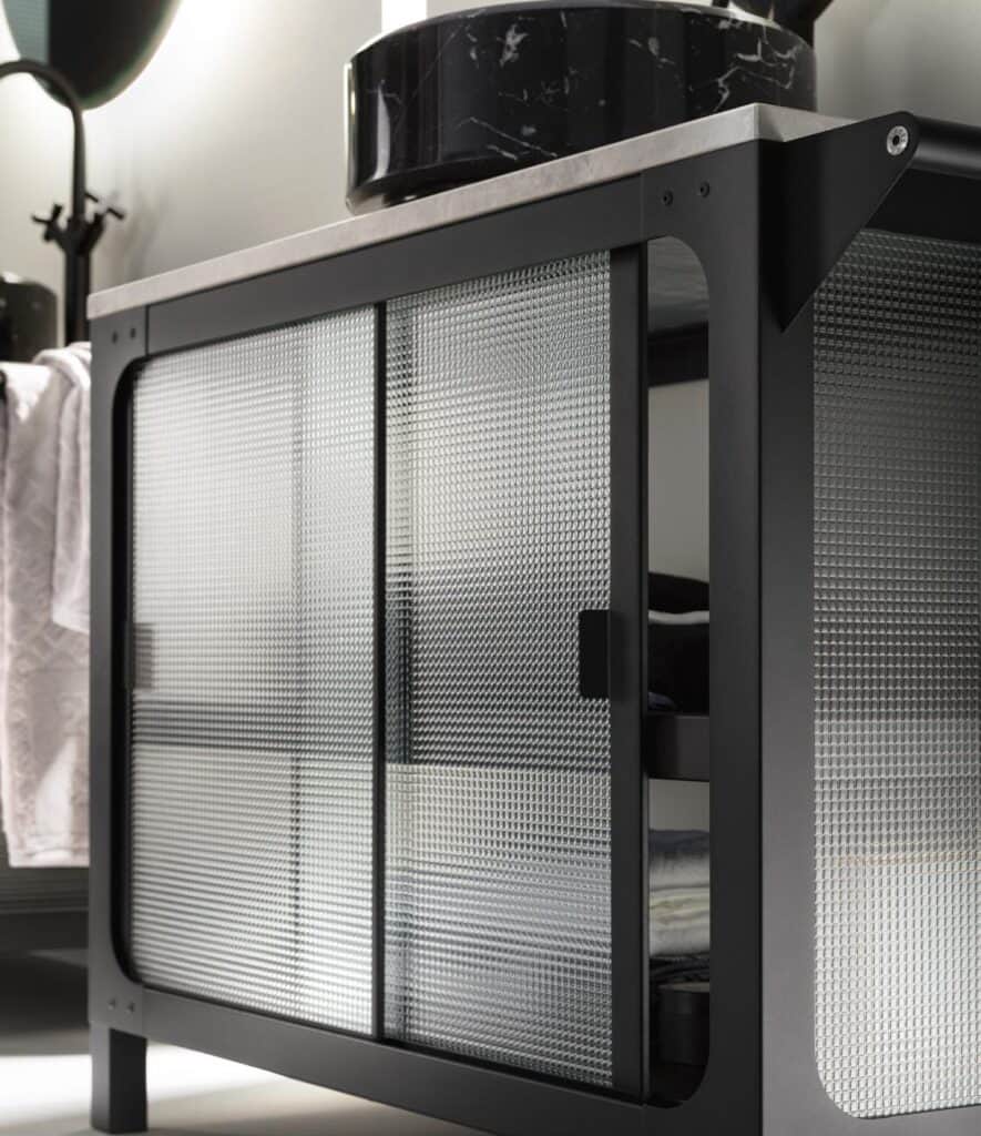 Textured glass sliding door on a modern metal cabinet.
