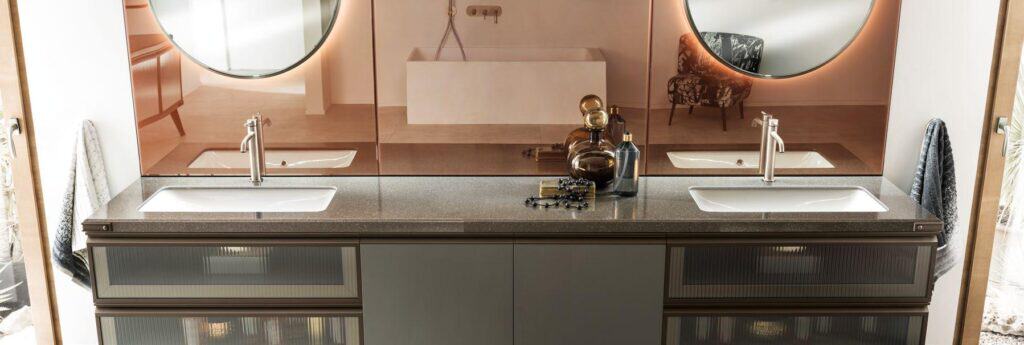 Modern bathroom with double sinks, large mirrors, and stylish decor.