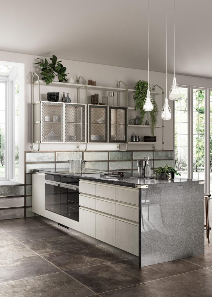 Modern kitchen with a sleek design, featuring a dark countertop, metallic cabinets, hanging pendant lights, and large windows.