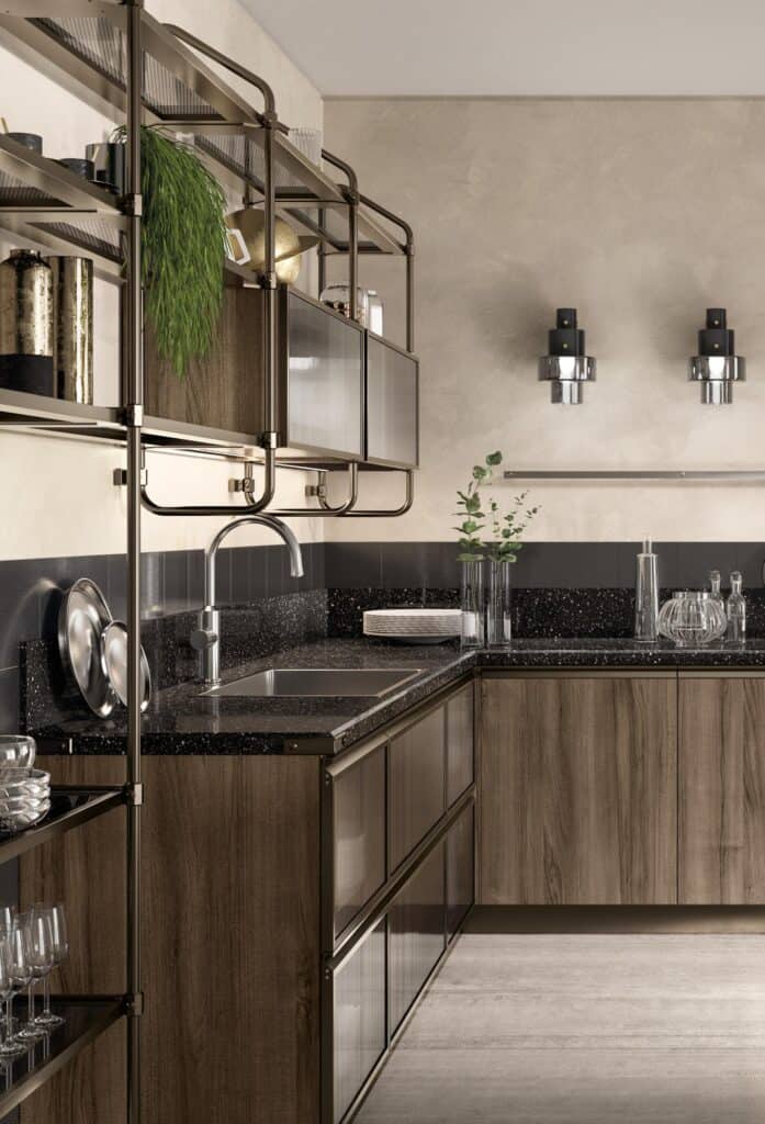 Modern kitchen with wood cabinets, black speckled countertops, metallic shelves, and wall-mounted lights.