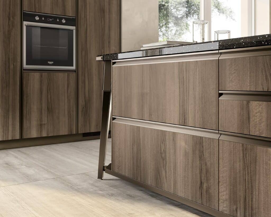 Modern kitchen with wooden cabinets, a built-in oven, and a polished countertop.