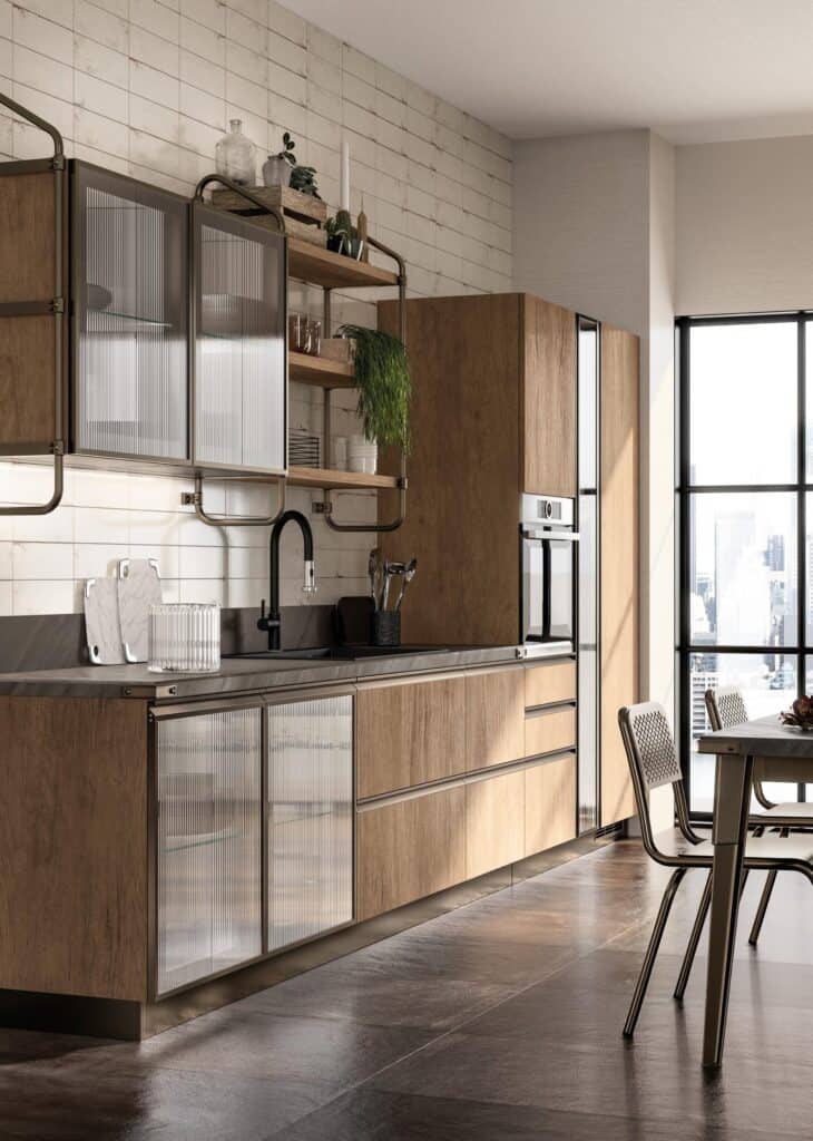 Modern kitchen with wooden cabinets, glass panel doors, black faucet, and industrial-style shelving. Large windows provide natural light and a city view.