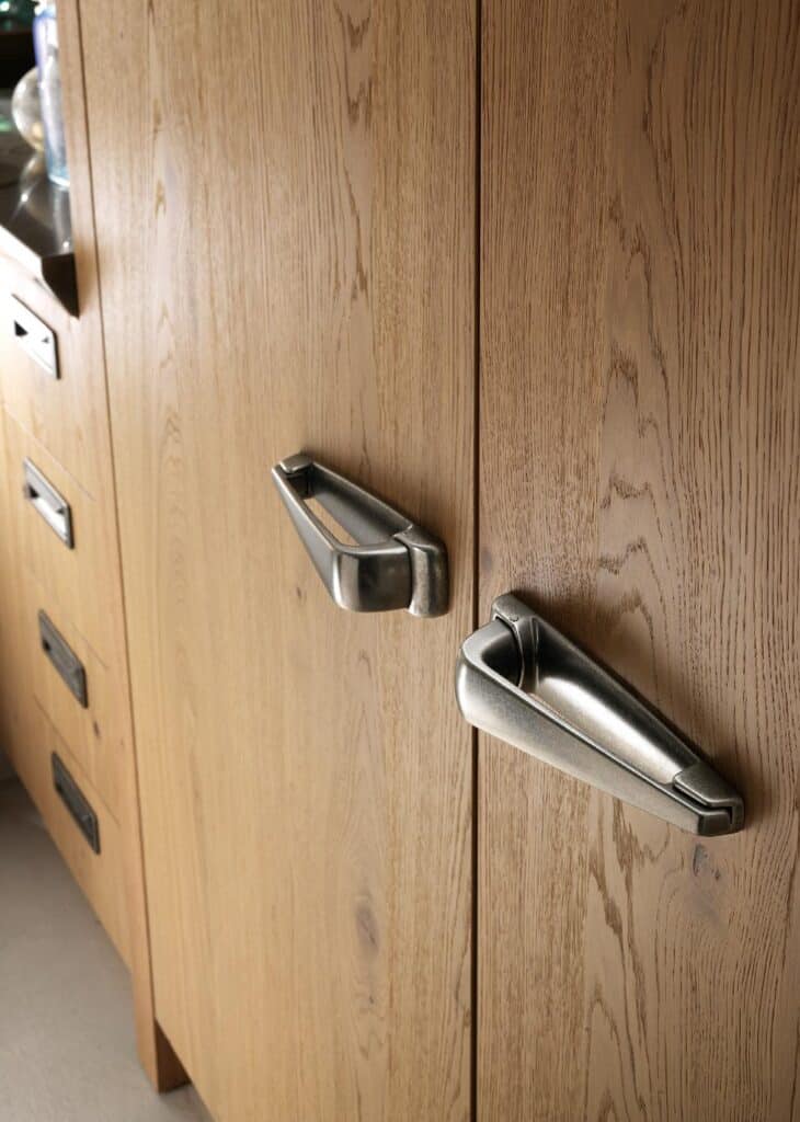 Wooden cabinet with modern metallic handles.