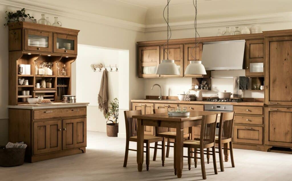 Wooden kitchen with dining table, chairs, cabinets, open shelving, pendant lights, and modern appliances.
