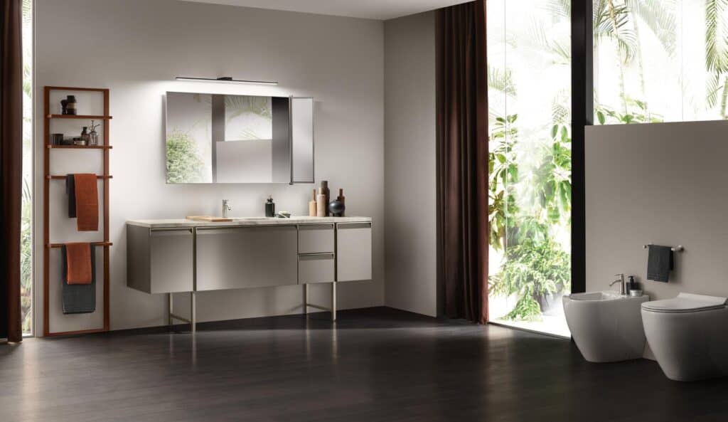 Modern bathroom with sleek fixtures, large mirror, wooden floor, and a big window with a view of lush greenery.