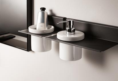 Wall-mounted bathroom accessories with a soap dispenser and a holder for toiletries.