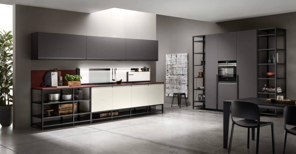 Modern kitchen interior with dark cabinetry, open shelving, and minimalist design.