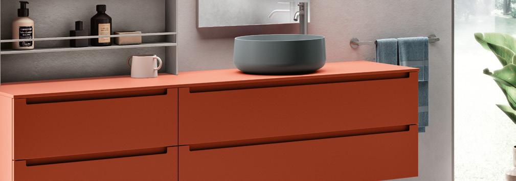 Orange bathroom vanity with a round basin, towel rack, and shelves with toiletries.
