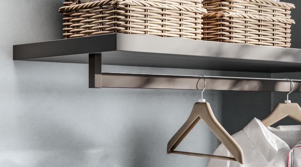 A modern clothes rail with wooden hangers and a shelf above, featuring wicker baskets.