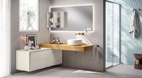 Modern bathroom interior with a wooden countertop and vessel sink, large mirror with integrated lighting, and geometric patterned wall tiles.