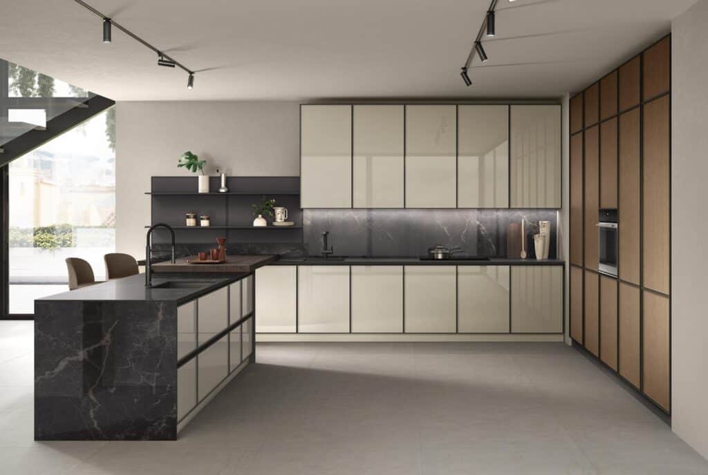 Modern kitchen with sleek cabinetry, marble countertop and backsplash, integrated appliances, and overhead track lighting.