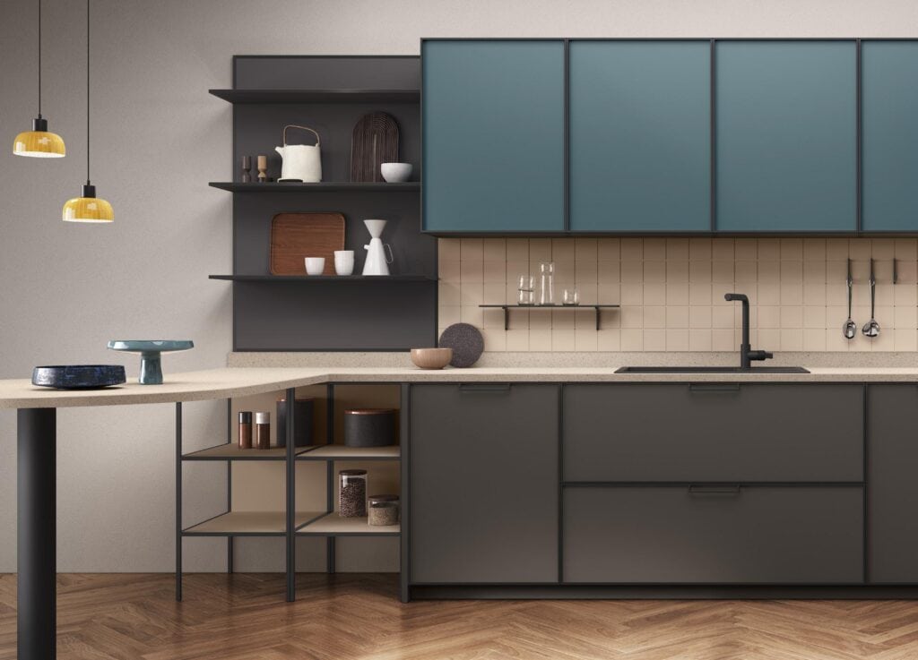 Modern kitchen interior with teal cabinets, open shelving with decorative items, a beige tiled backsplash, and wooden floor.