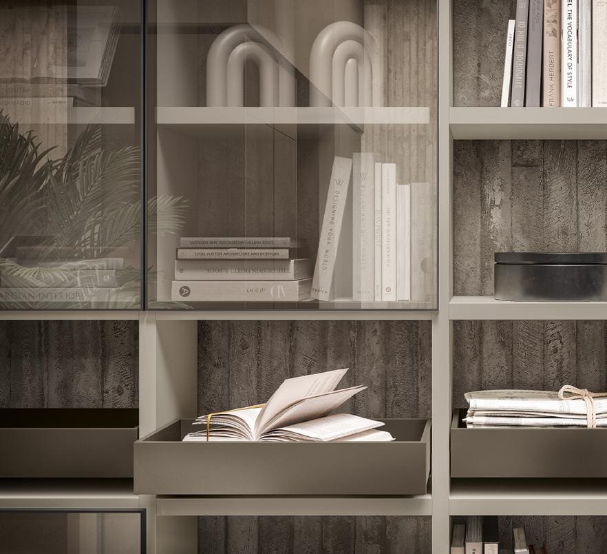 Bookshelf with gray shelves, featuring an open book in a tray, and various books and decorative items.