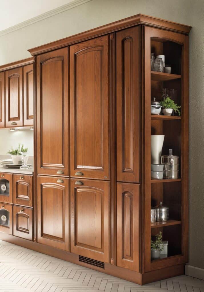 Wooden kitchen cabinets with an integrated open shelf displaying dishes and plants.