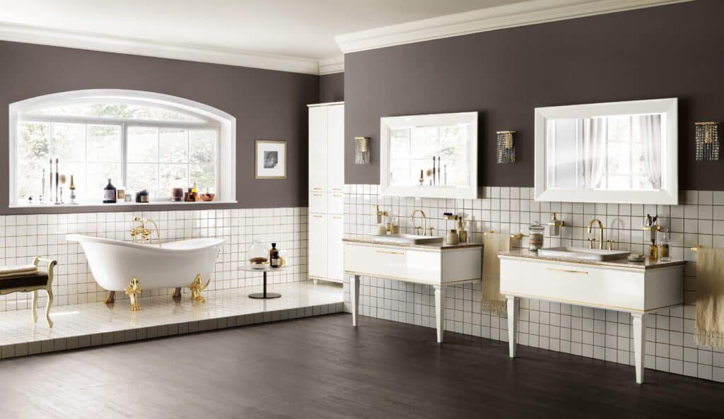 Luxurious bathroom with a freestanding clawfoot bathtub, two modern vanities with mirrors, tiled walls, and large window.