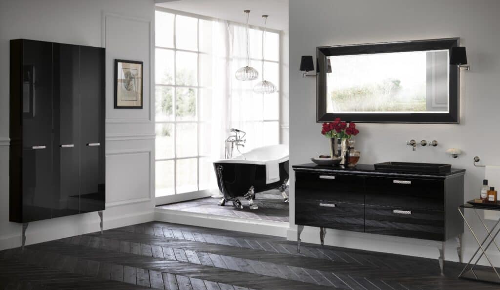 Elegant bathroom with a freestanding black bathtub, large window, glossy black cabinets, and a matching vanity with a rectangular mirror.