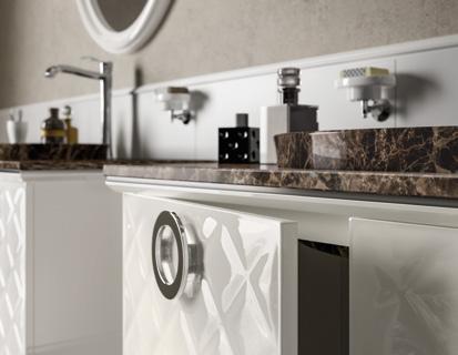Modern bathroom vanity with white textured cabinet doors, marble countertop, chrome fixtures, and small shelves with toiletries.