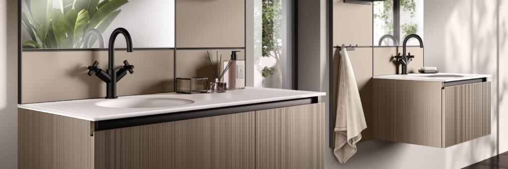 Modern bathroom with two beige vanities, black faucets, and a wall mirror, featuring a towel hanging on the side.