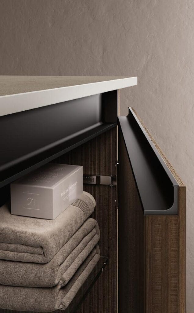 Open wooden cabinet with folded towels and a box inside, featuring a modern design.