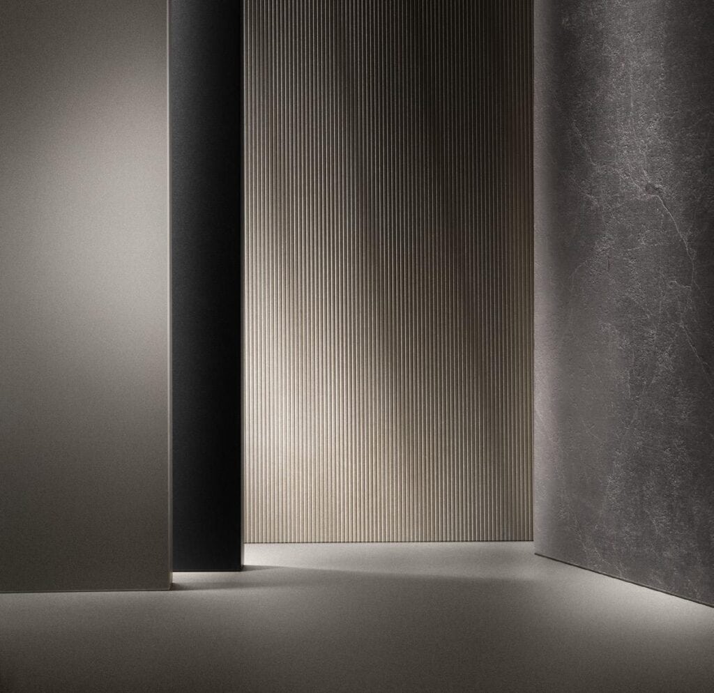 Minimalist interior with textured walls in shades of gray.