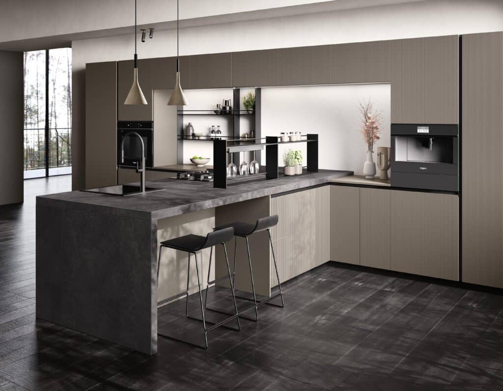 Modern kitchen with a large island, bar stools, pendant lighting, and built-in appliances, featuring dark and neutral color tones.
