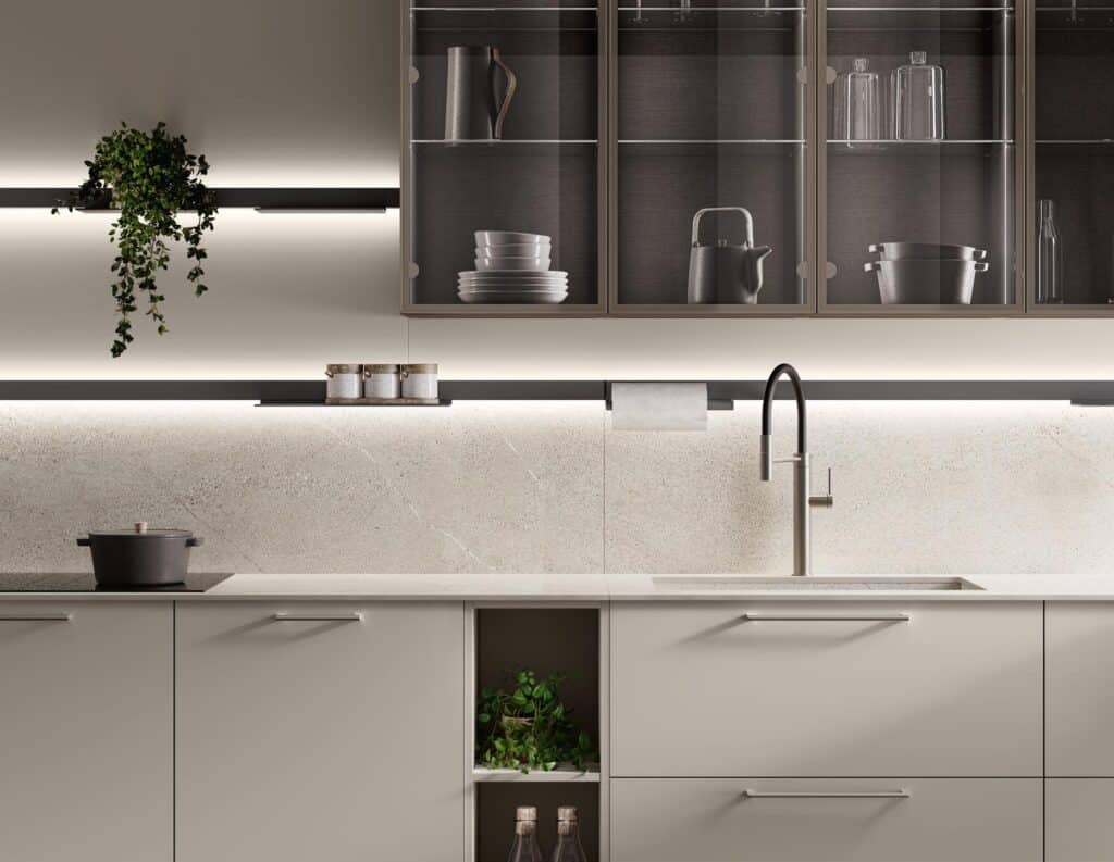 Modern kitchen with light cabinetry, a sleek faucet, and open shelving with decorative items.