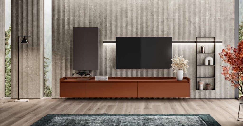 Sophisticated living room with a wall-mounted TV, modern cabinetry, and decorative accents including a floor lamp, plants, and a textured rug.
