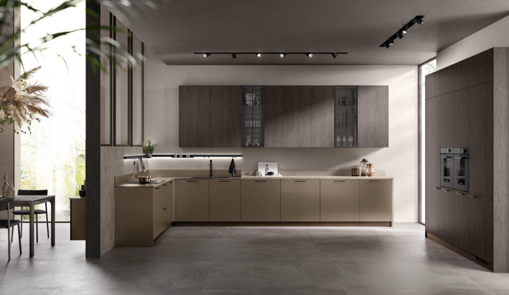 Modern kitchen interior with wooden cabinets, built-in appliances, and a dining table by large windows.