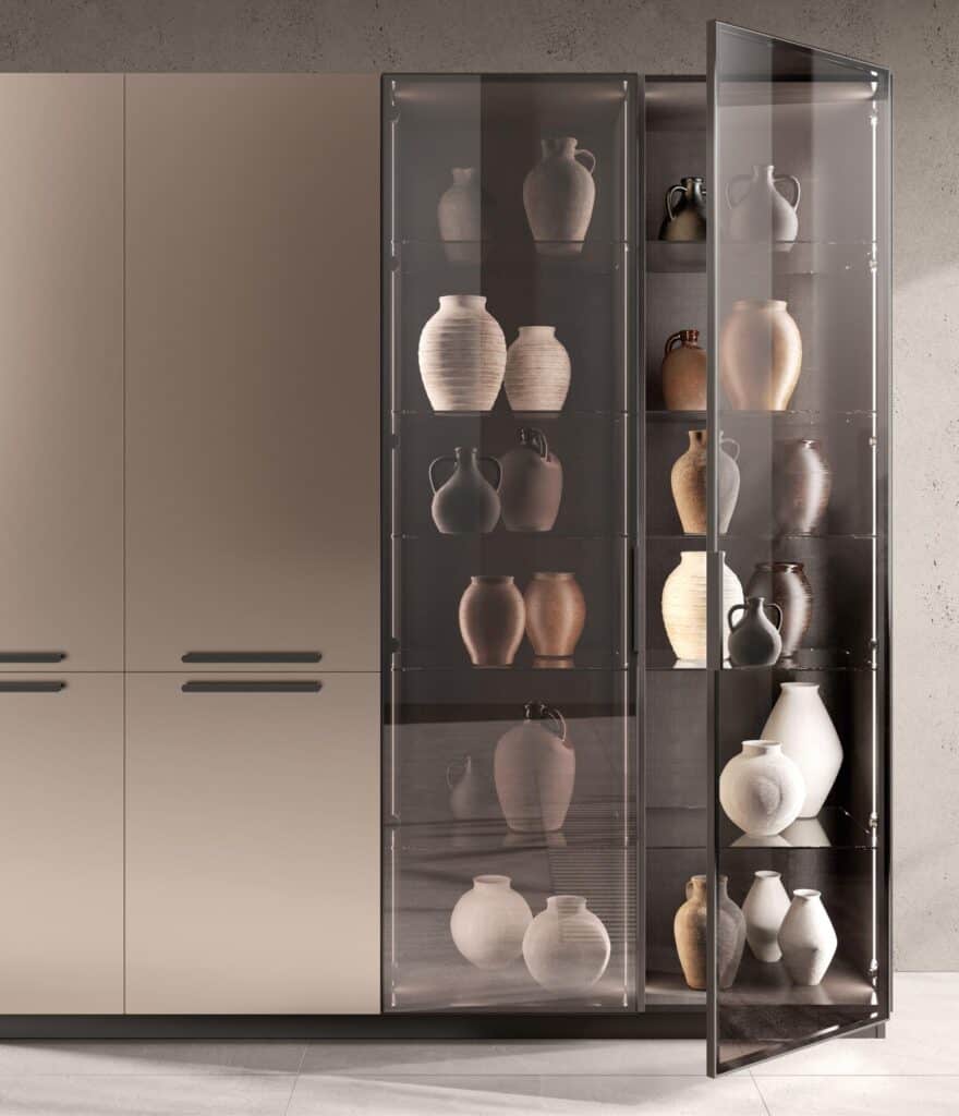Modern cabinet with a glass door displaying an assortment of decorative vases on shelves.