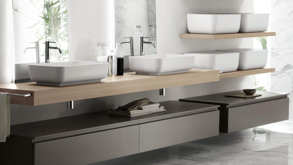 Modern bathroom with double sinks, wooden countertop, and minimalist decor.