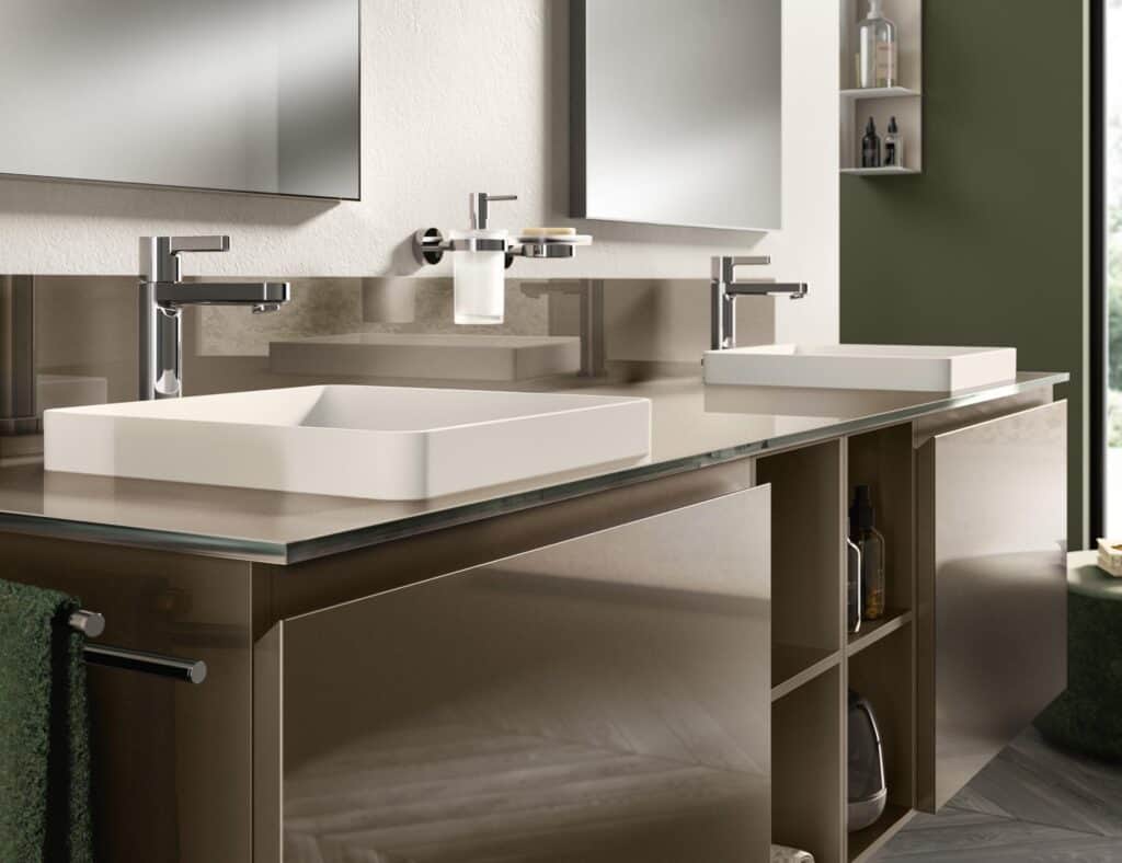 Modern bathroom with dual sinks, chrome faucets, mirrored wall cabinets, and brown shelving.