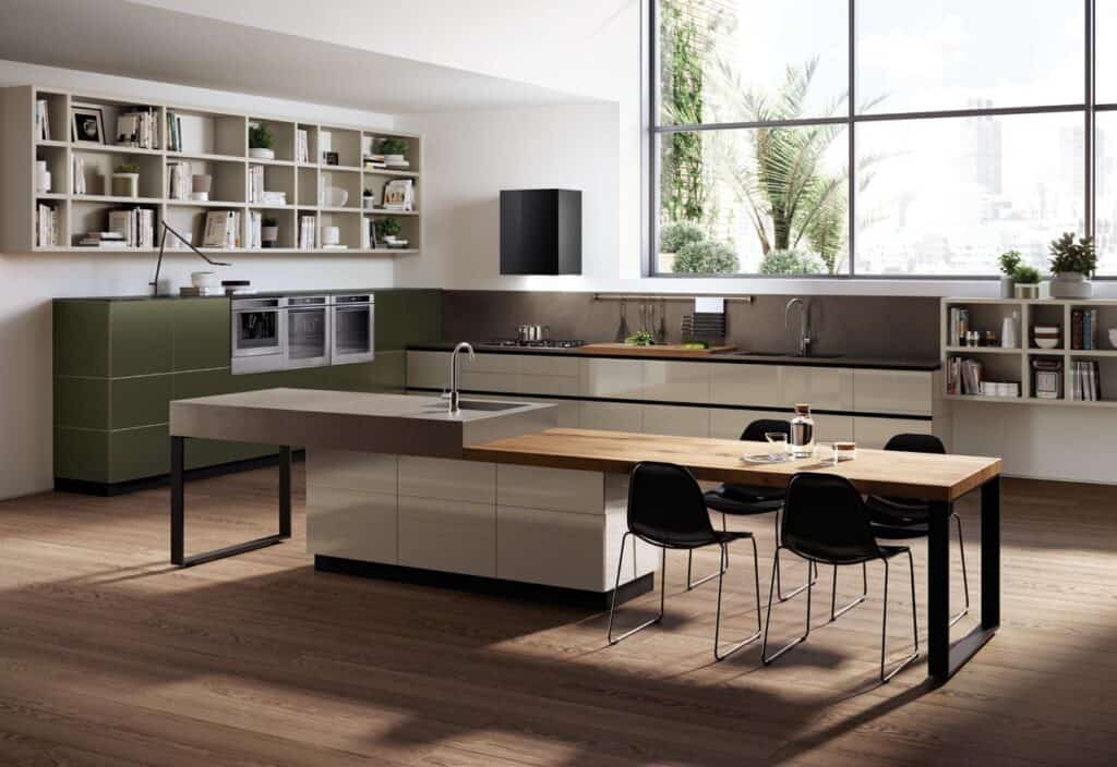 Modern kitchen with sleek cabinets, large window, island with sink, and wooden dining table with black chairs.