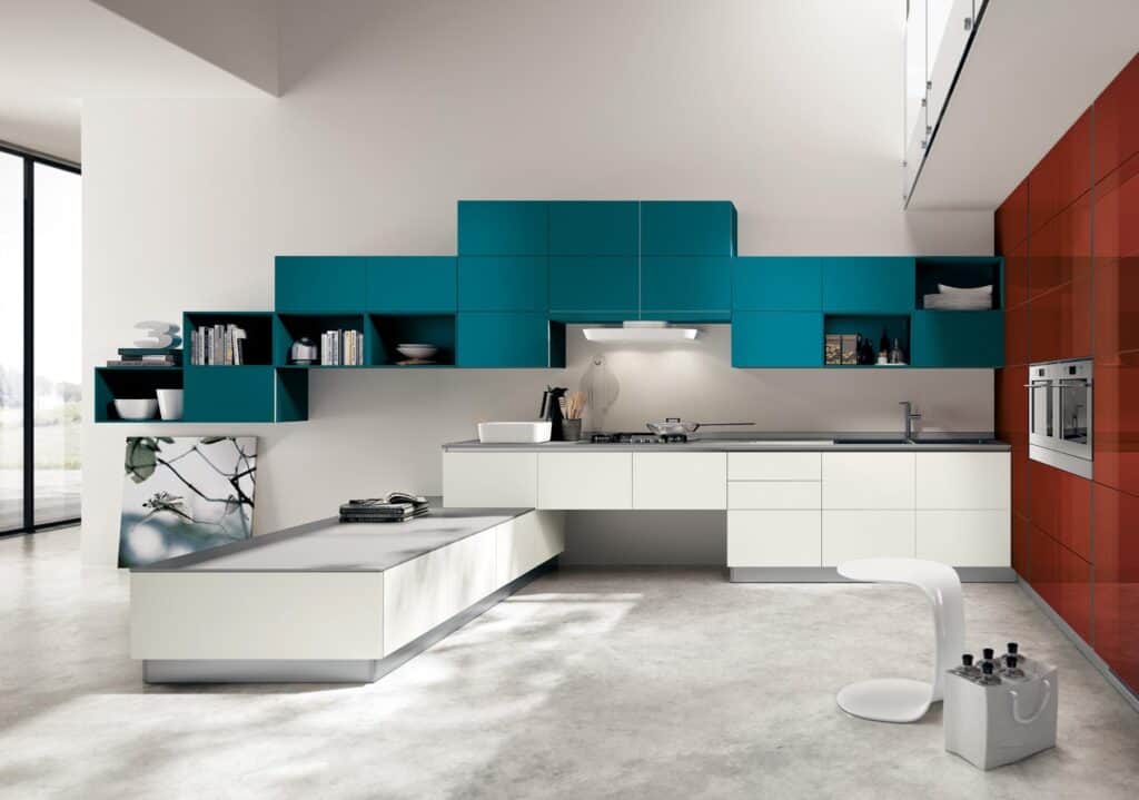 Modern kitchen with teal and white cabinetry, minimalistic design, and a sleek countertop with integrated stove and sink.