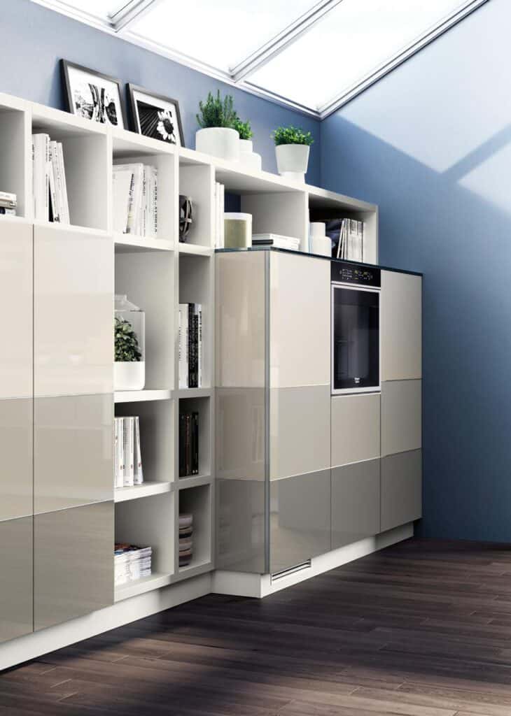 Modern kitchen with glossy cabinetry, open shelving with books and plants, and a built-in oven under a skylight.