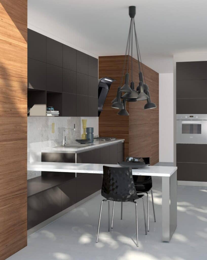 Modern kitchen with dark cabinets, wooden accents, marble countertop, and a unique black pendant light fixture.