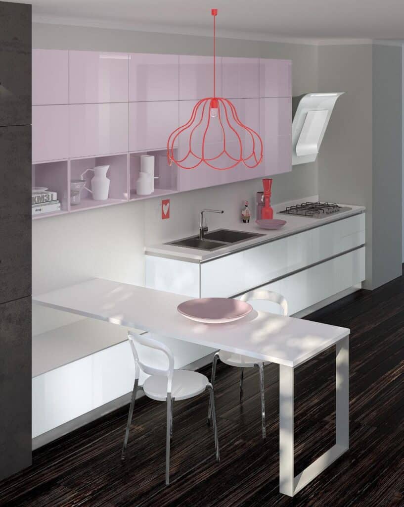 Modern kitchen with glossy white cabinets, integrated appliances, a sleek sink, a unique red pendant light, and a minimalist white dining table with two chairs.