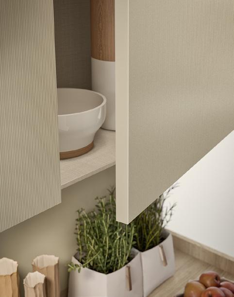 Open kitchen cabinet with a bowl inside, and herbs in paper bags on the countertop below.